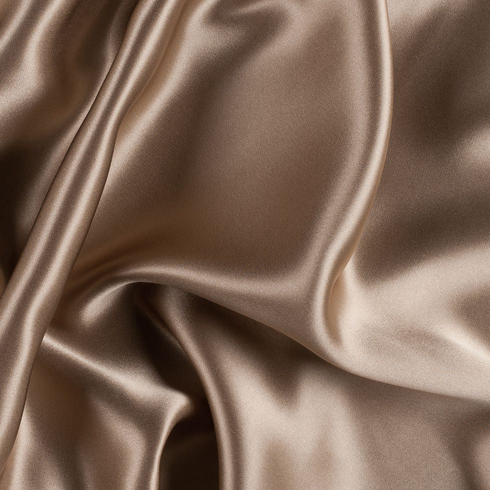 Luxurious dark brown silk texture representing the elegance of Midnight Seduction perfume by ScentSociety