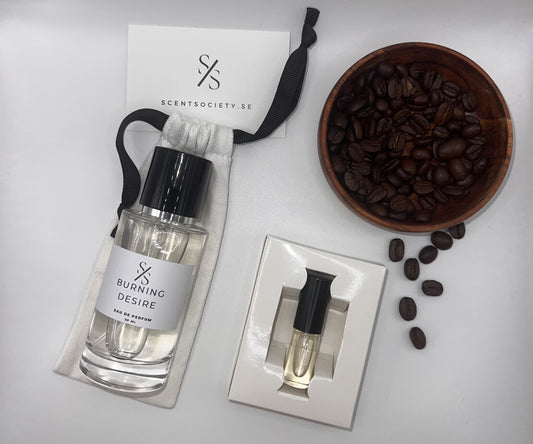 Perfume bottle and gift set with coffee beans representing rich cherry and spicy notes of Burning Desire fragrance by ScentSociety
