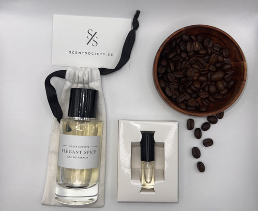 Perfume bottle and gift set with coffee beans representing rich cherry and spicy notes of Elegant Spice fragrance by ScentSociety