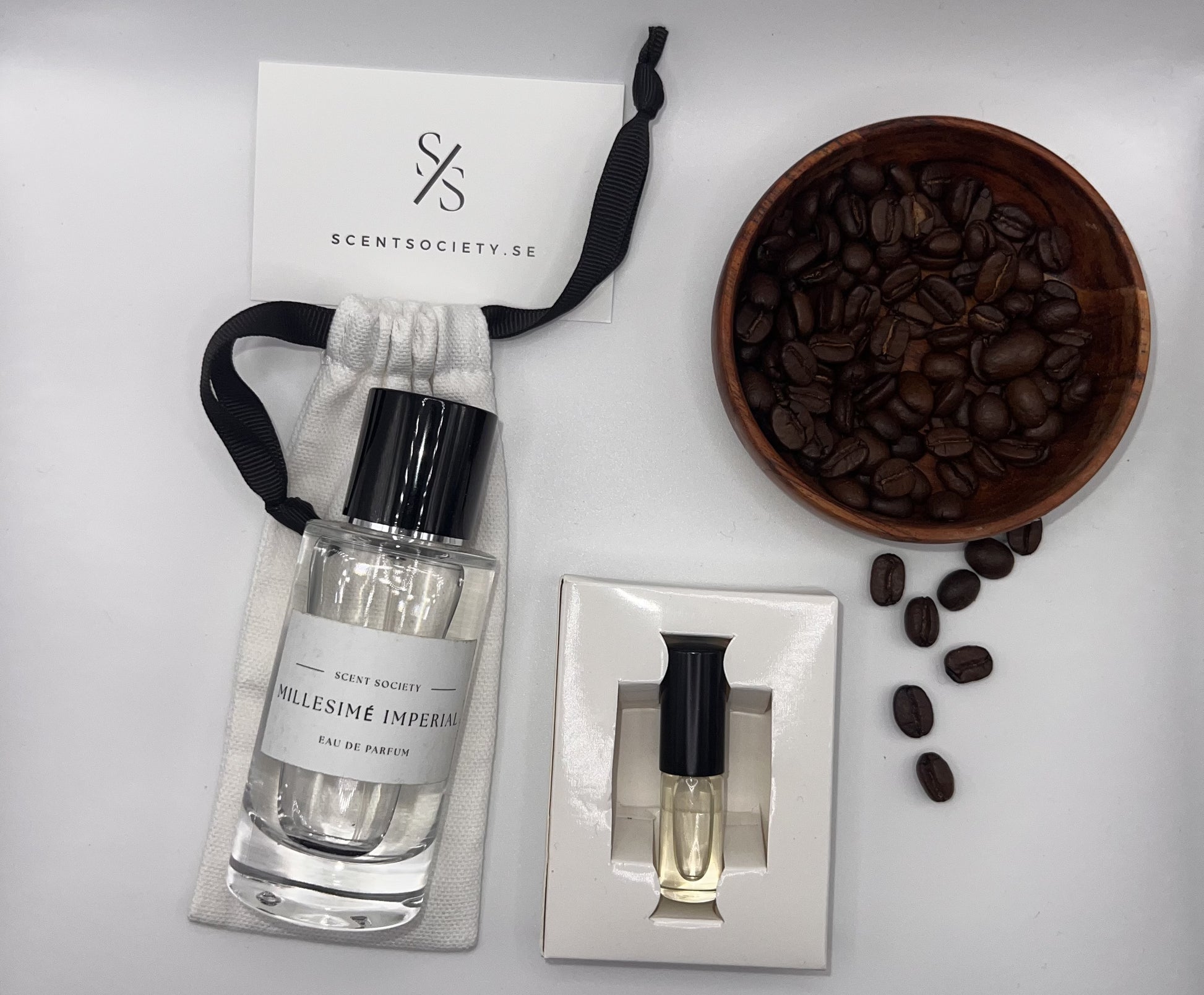 Perfume bottle and gift set with coffee beans representing rich cherry and spicy notes of Imperial fragrance by ScentSociety