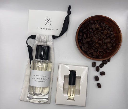Perfume bottle and gift set with coffee beans representing rich cherry and spicy notes of Leather Elixir fragrance by ScentSociety