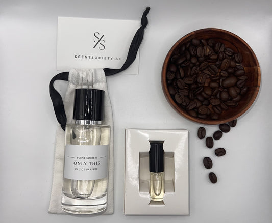 Perfume bottle and gift set with coffee beans representing rich cherry and spicy notes of Only This fragrance by ScentSociety