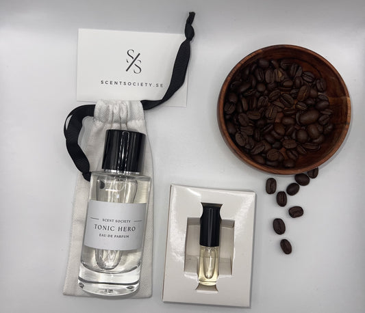 Perfume bottle and gift set with coffee beans representing rich cherry and spicy notes of Tonic Hero fragrance by ScentSociety